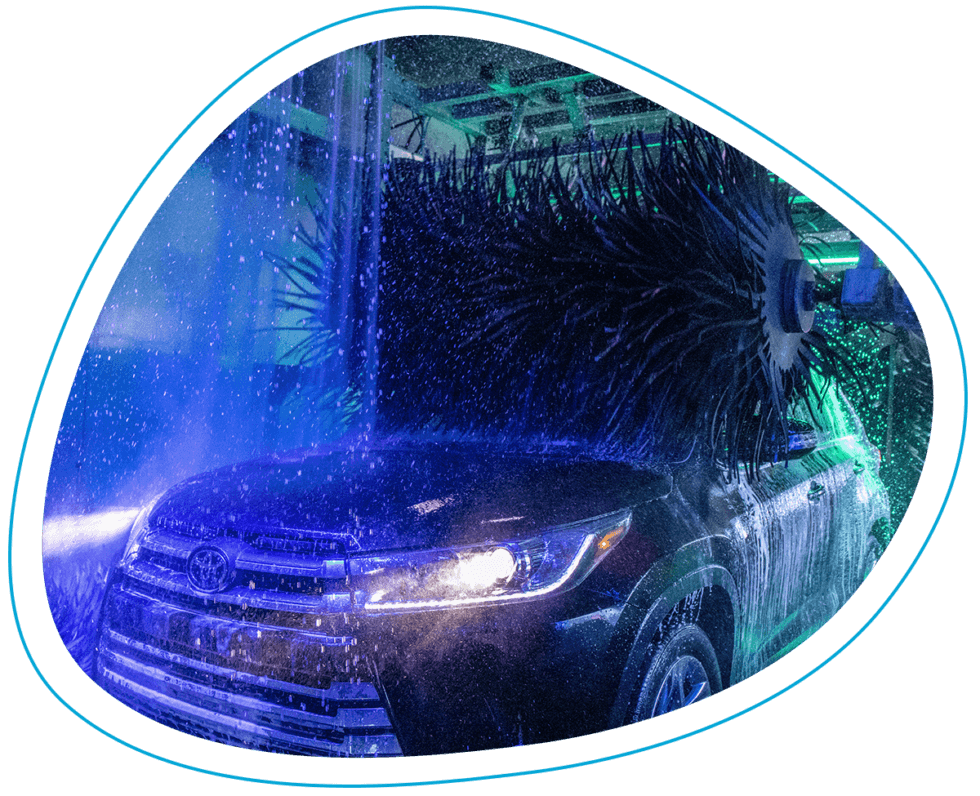 City Park Express Car Wash tunnel with blue brushes washing a car